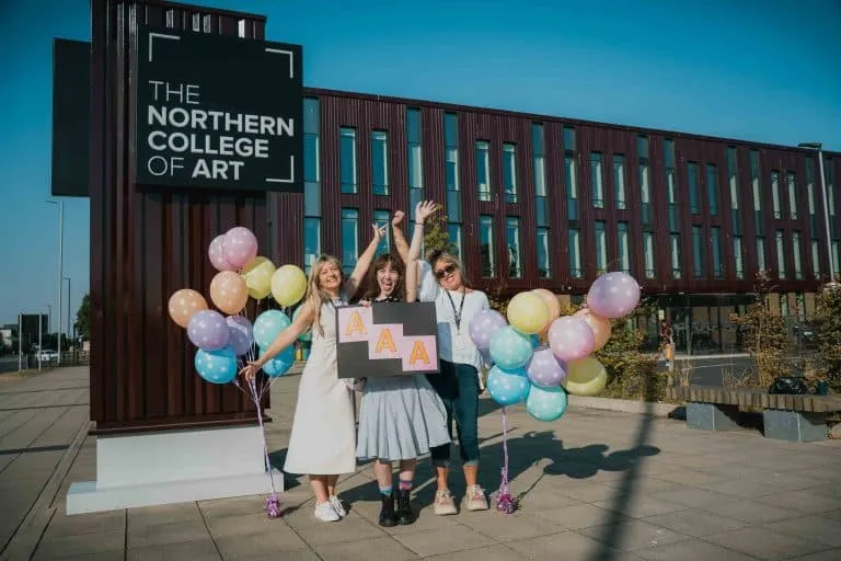 Tutor Katie Slater with student Pheobe Purdy and tutor Amanda Smith celebrating her amazing results